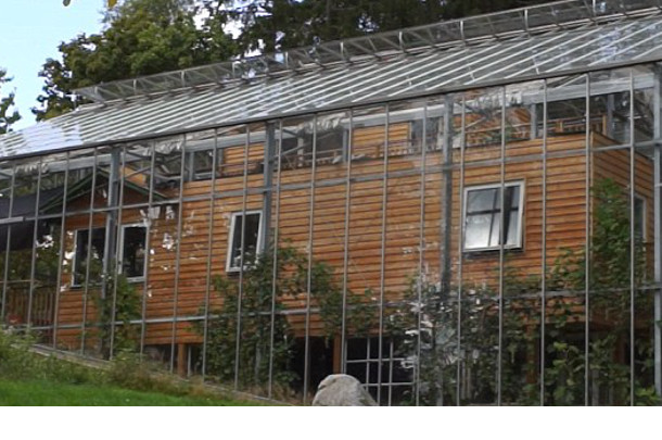 Couple Builds Greenhouse AROUND House to Grow Food and Keep Warm