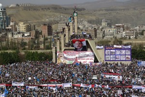 Yemenis display giant banners bearing portraits of former president Ali Abdullah Saleh during a protest against the Saudi-led coalition, commemorating one year of the alliance's military campaign against insurgents on March 26, 2016 next to the Monument to the Unknown Soldier in the Yemeni capital Sanaa. The protest was called for by the General People's Congress, the party of rebel-allied former president Ali Abdullah Saleh, who appeared briefly at the rally, an AFP photographer said. The military intervention that began on March 26 last year has yet to deal a decisive blow to the Iran-backed rebels, who continue to control the capital and large parts of the country. / AFP / MOHAMMED HUWAIS