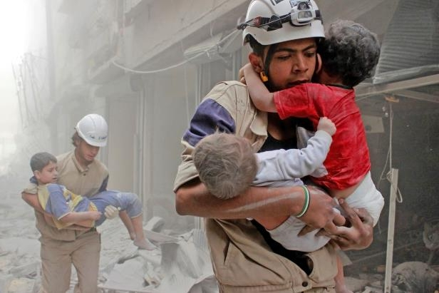 1 members-of-the-white-helmets-rescue-children-from-an-attack-in-june__939593_