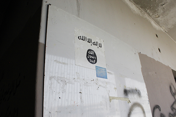 One of many ISIS/al Nusra insignias and flags found inside the same White Helmet facility in Hanano, East Aleppo (Photo: Patrick Henningsen, May 2017)