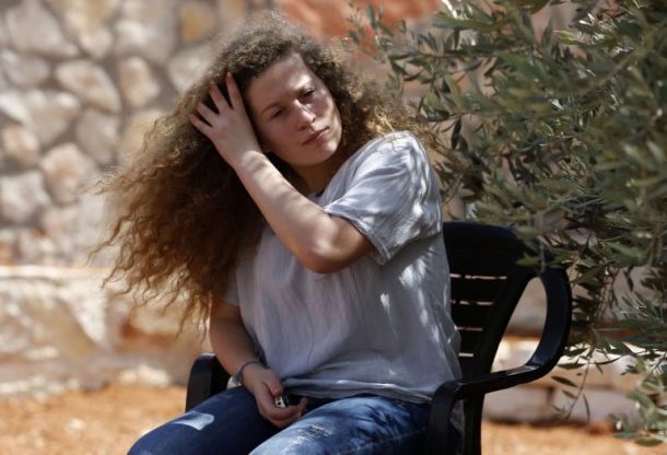 Ahed Tamimi, 17, gestures during an interview with Agence France-Presse, 30 July 2018 (AFP)
