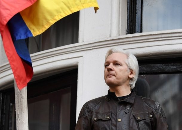 Wikileaks founder Julian Assange speaks to the media from the balcony of the Ecuadorian embassy in London on 19 May 2017 (AFP)