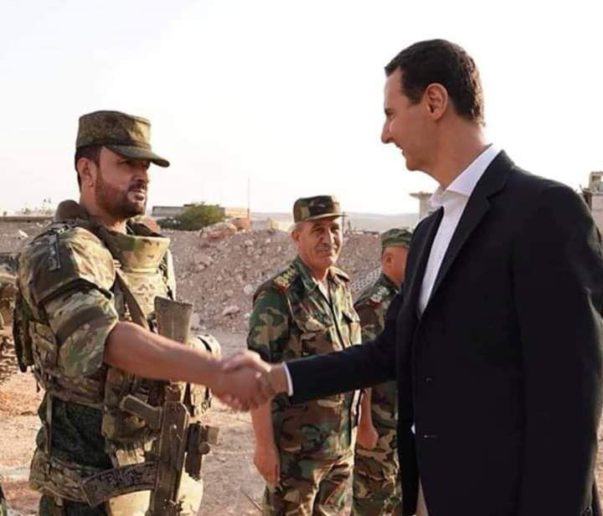 The Syrian President Bashar Al-Assad meets with the commander of the 25th Special Mission Forces Major General Suheil Al-Hassan in the Idlib province town of Al-Hobeit.