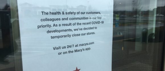 A note to customers on the Macy's entrance.