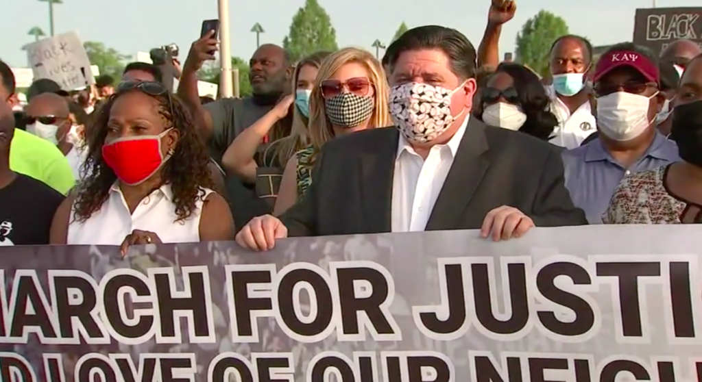 Illinois Gov. J.B.Pritzker masked while attending protest rally. (Image Source: ABC7 Chicago)